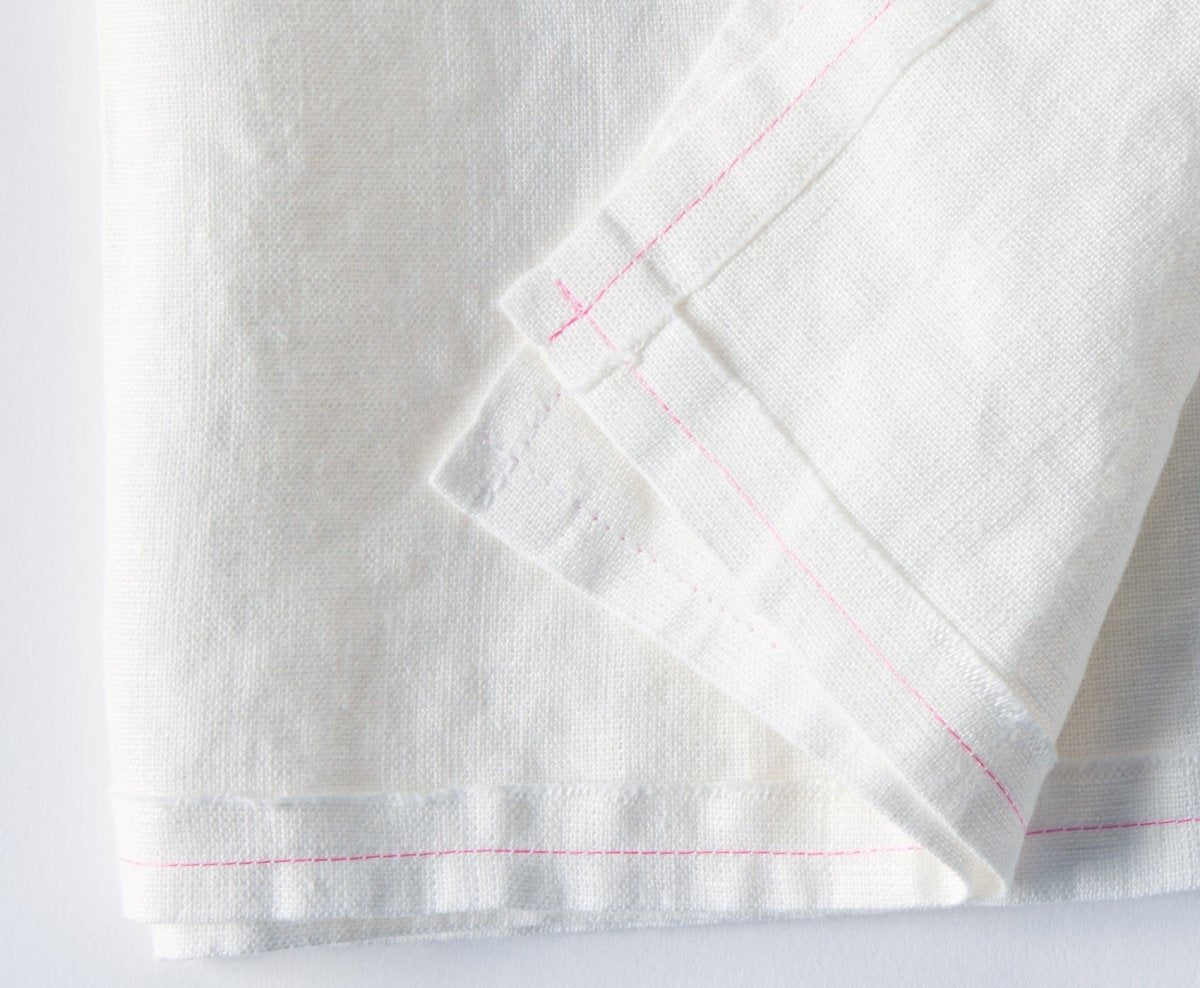 https://www.celinamancurti.com/cdn/shop/files/Delicious-Off-white-Linen-Napkin-Pink-stitching-Set-of-2-napkins-2.jpg?v=1693501606&width=1445