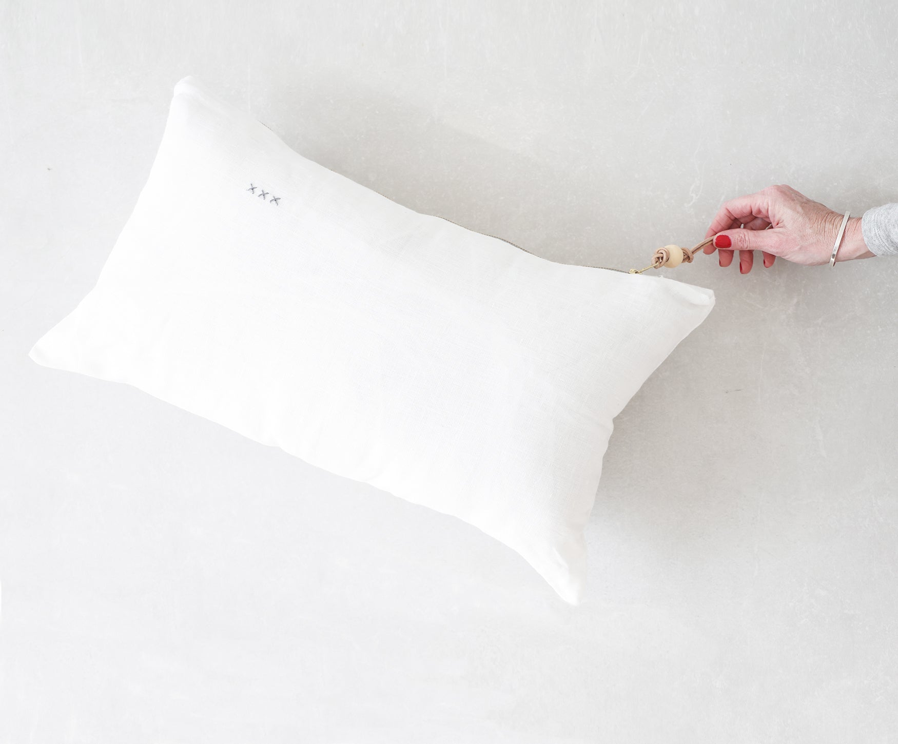 White linen lumbar outlet pillow